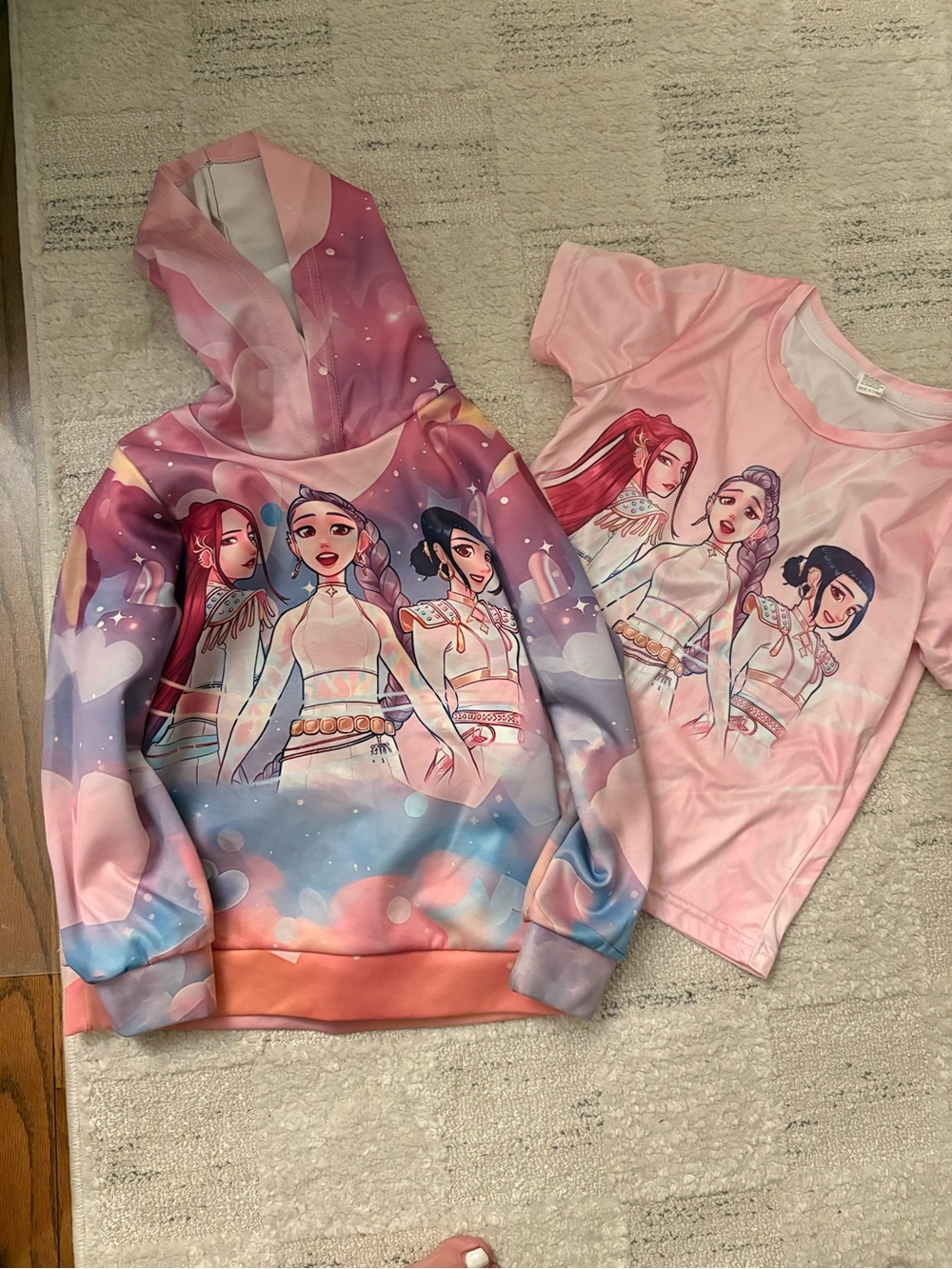 Hoodie and tee with K-pop graphic on front and back of both